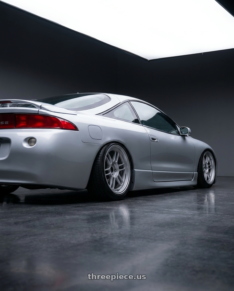 1998 Mitsubishi eclipse gsx with Enkei RPF1RS 5x114.3 18x9.5+12 Silver wheels rear three quarter view slight stretch tires