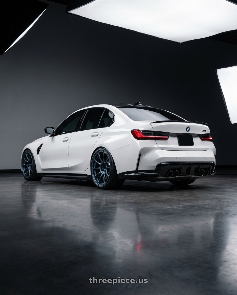 2024 bmw m3 comp with Volk Racing ZE40 5x112 19x10 +20 MATTE BLUE GUNMETAL wheels rear three quarter view square tires