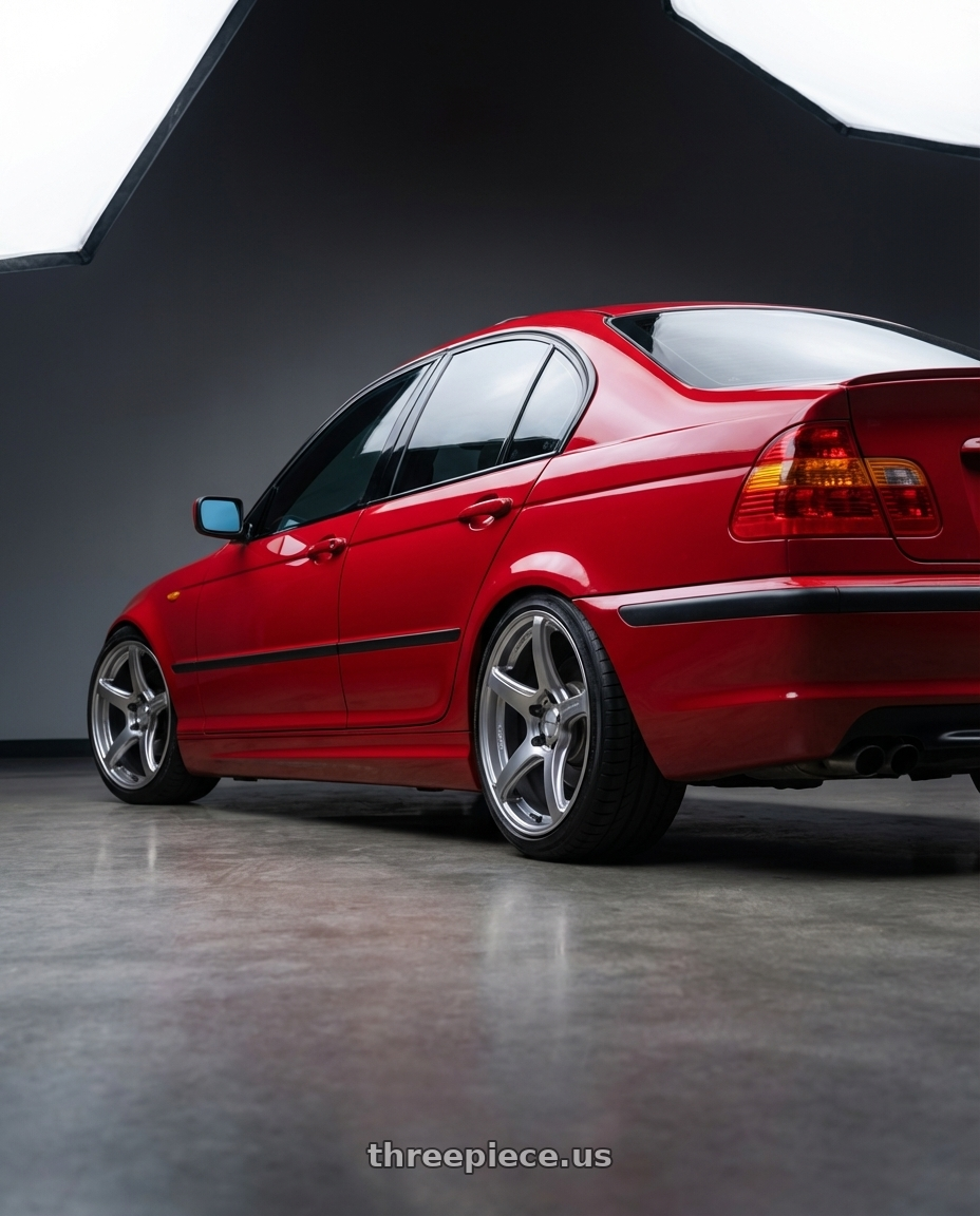 2004 BMW 330i ZHP with Work Emotion T5r 5x114.3 17x7 +53 Glow Silver wheels rear three quarter view square tires