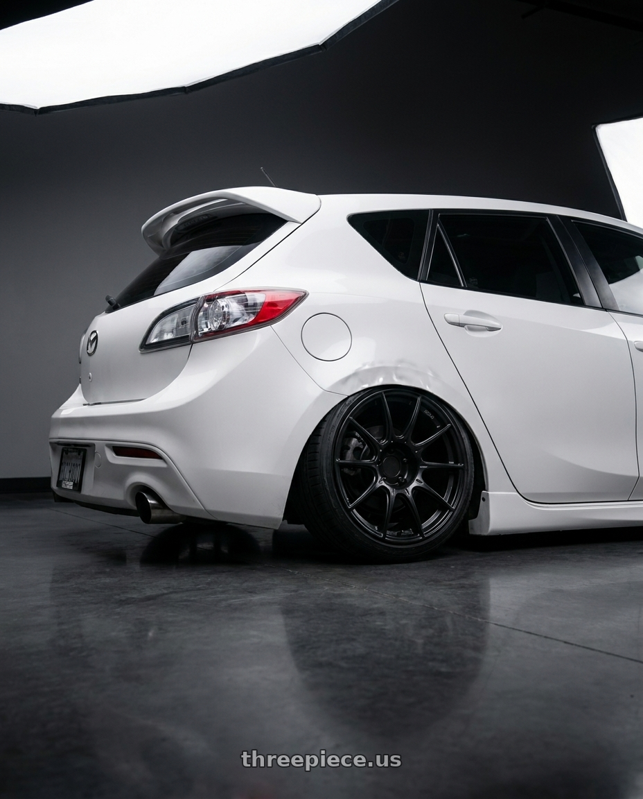 2012 Mazda Mazdaspeed3 with Ssr Gtx01 5x114.3 18x9.5+22  FLAT BLACK wheels rear three quarter view slight stretch tires