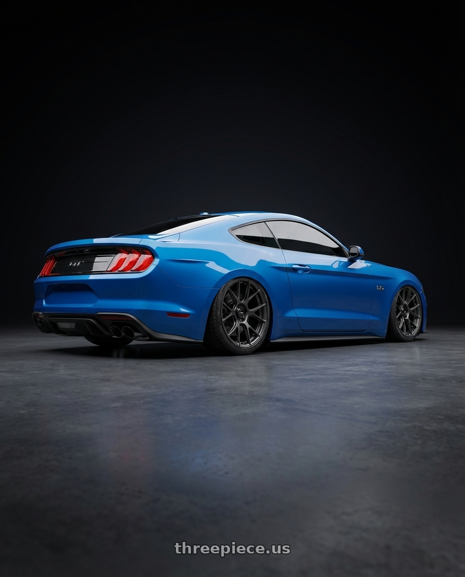 2022 Ford Mustang GT with Konig Ampliform 5x114.3 20x8.5+43 Dark Metallic Graphite wheels rear three quarter view slight stretch tires