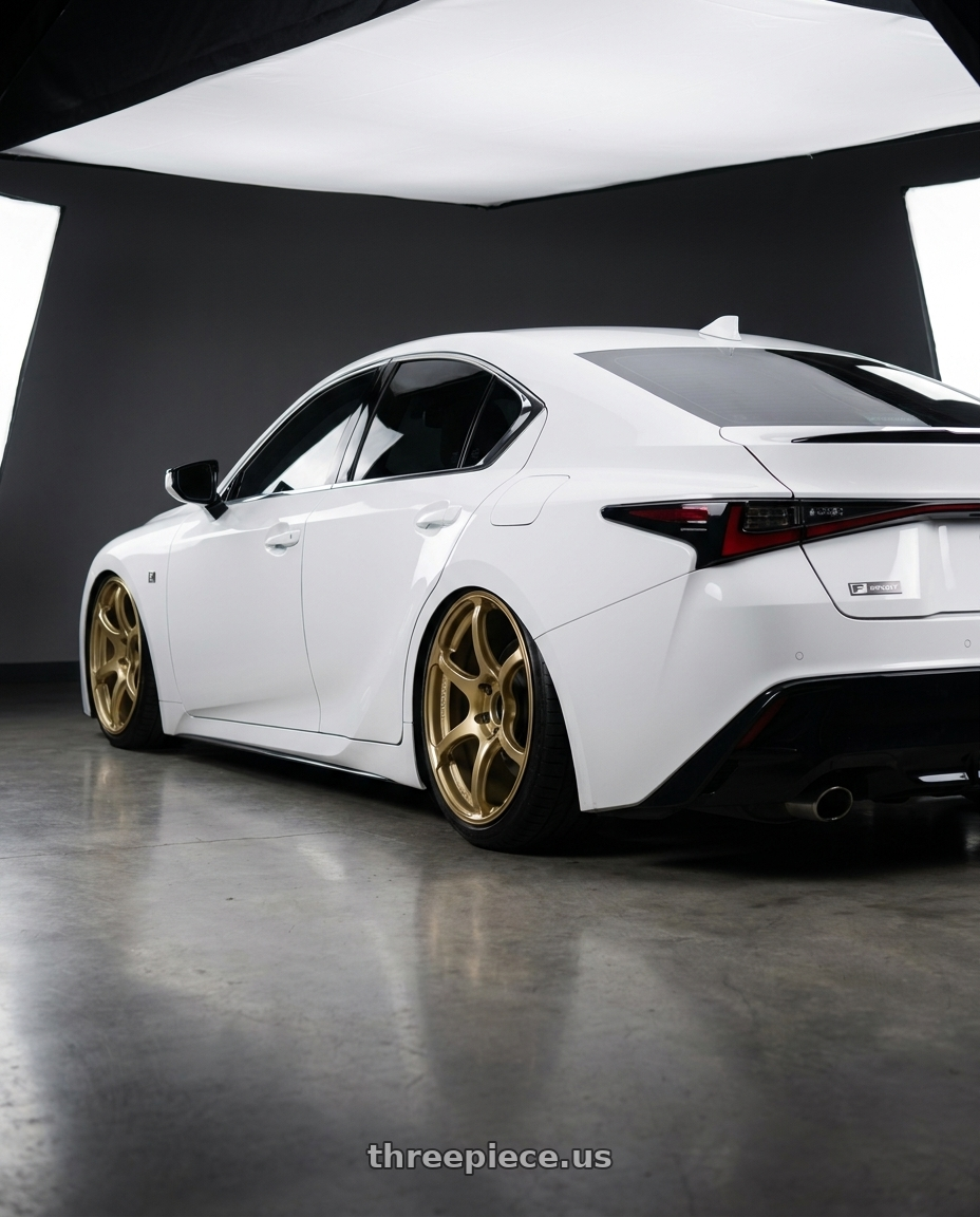 2024 Lexus IS 350 with Advan RGIII 5x114.3 19x10.5+25 Gold wheels rear three quarter view slight stretch tires