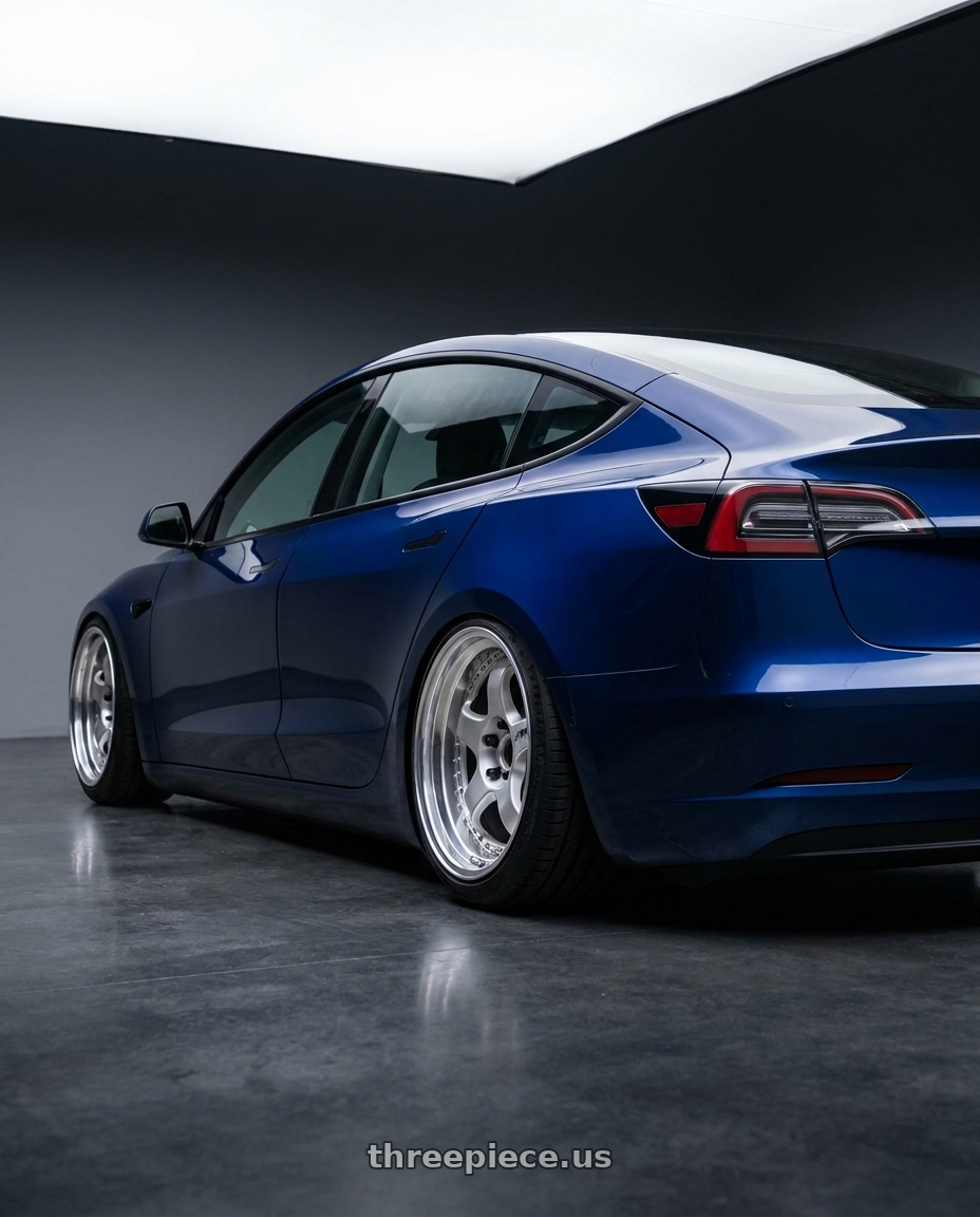 2023 Tesla model 3 with Work Meister S1 3P 5x114.3 18x9.5+24 O Disk Silver wheels rear three quarter view square tires