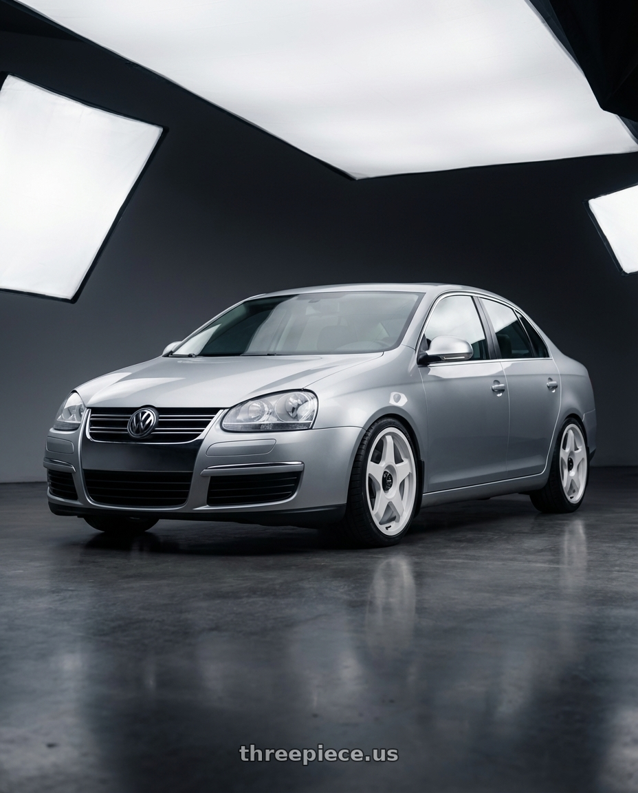 2009 Volkswagen Jetta GLI MK5 with fifteen52 CHICANE 5x112 / 5x120 18x8.5 +35 RALLY WHITE (GLOSS WHITE) wheels front three quarter view lowered stance