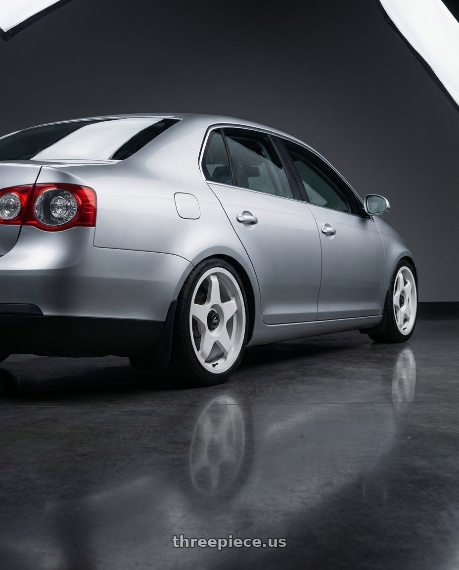 2009 Volkswagen Jetta GLI MK5 with fifteen52 CHICANE 5x112 / 5x120 18x8.5 +35 RALLY WHITE (GLOSS WHITE) wheels rear three quarter view square tires