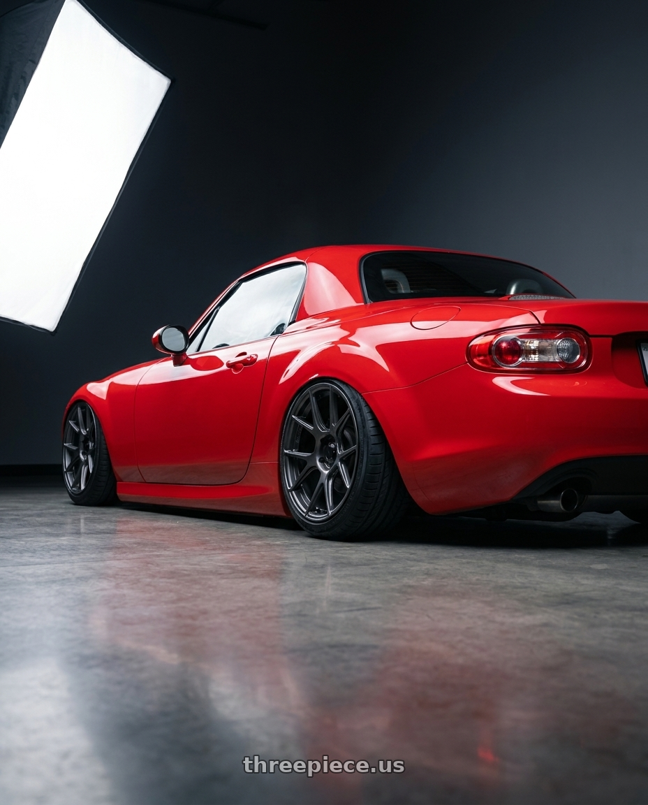 2012 Mazda MX-5 Miata NC with Konig Ampliform 5x114.3 17x9+40 Dark Metallic Graphite wheels rear three quarter view slight stretch tires