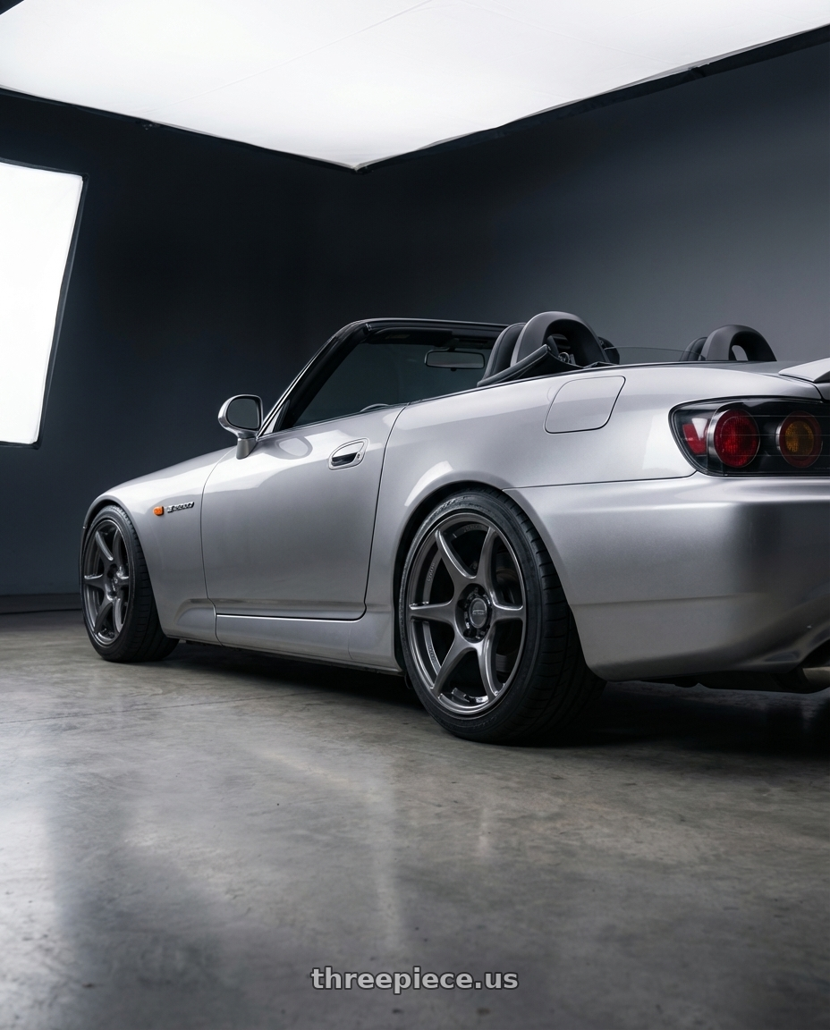 2009 Honda S2000 with Kansei K11G Tandem 5x114.3 17x9 35 Gunmetal wheels rear three quarter view square tires