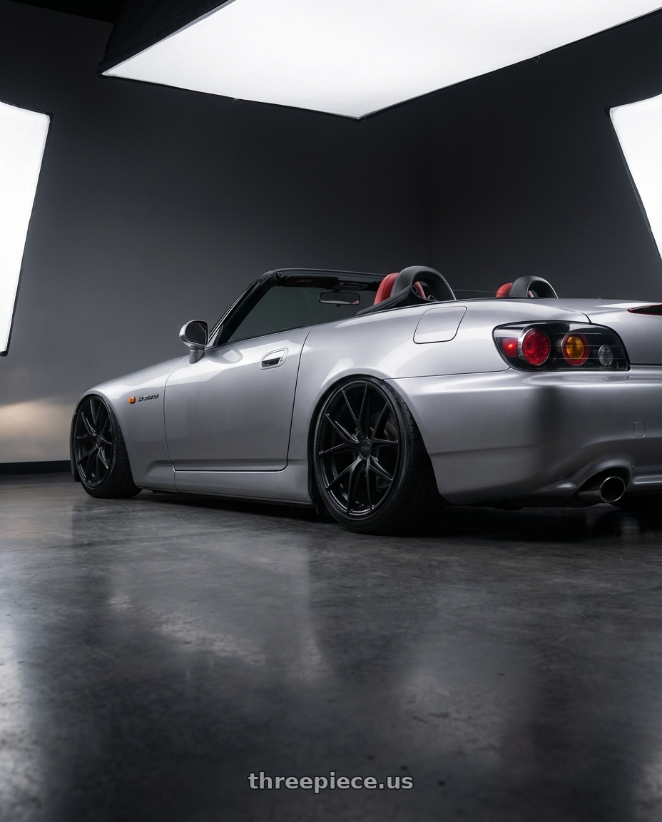 2009 Honda S2000 with Niche 1PC M117 MISANO 5X114.3 18X8 +42 MATTE BLACK wheels rear three quarter view slight stretch tires