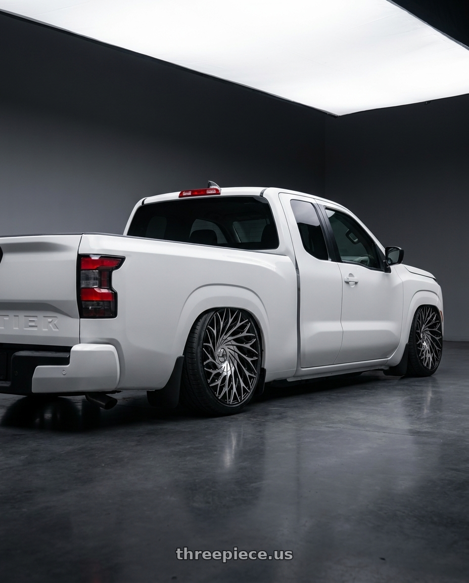 2025 nissan frontier king cab with Azara AZA-525 5x100/5x114.3 18x8 +35 Gloss Black & Machined wheels rear three quarter view extreme stretch tires