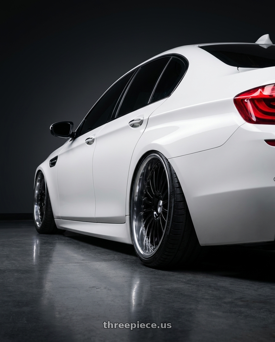 2012 BMW 550i with TSW SILVERSTONE 5X112 22X9 +37 GLOSS BLACK W/ MIRROR CUT LIP wheels rear three quarter view extreme stretch tires