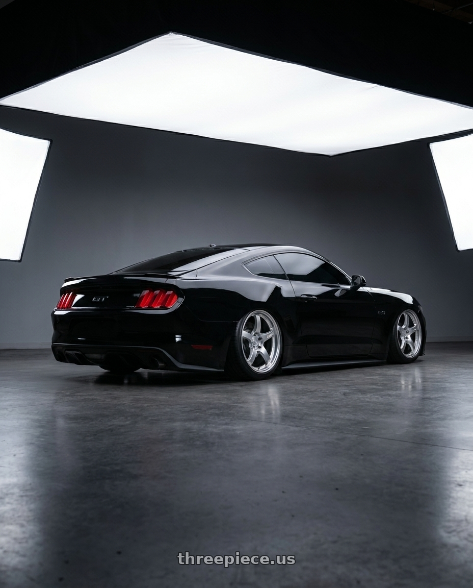 2017 Ford Mustang Gt black with Gram Lights 57CR 5x112 19x10.5 +35 GRACE SILVER wheels rear three quarter view square tires