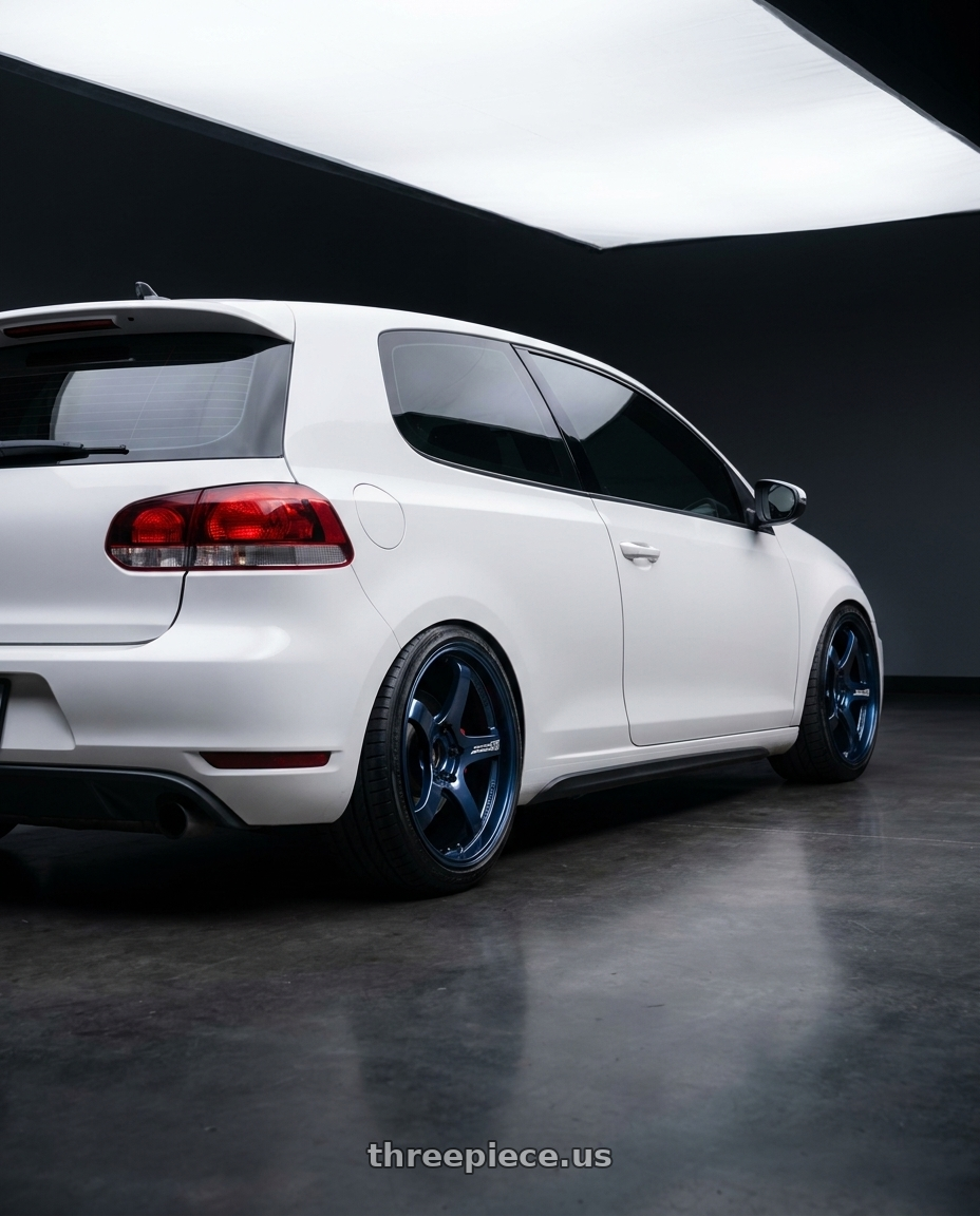 2012 VW GTI with Advan Racing GT PV 5x114.3 19x10.0 +35 RACING TITANIUM BLUE wheels rear three quarter view slight stretch tires