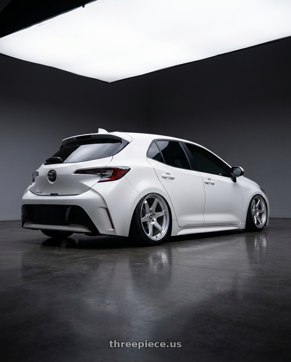 2023 Toyota Corolla Hatchback with ESR Wheels APEX SERIES AP6 5x114.3 18x10.5 +22 Hyper Silver wheels rear three quarter view slight stretch tires