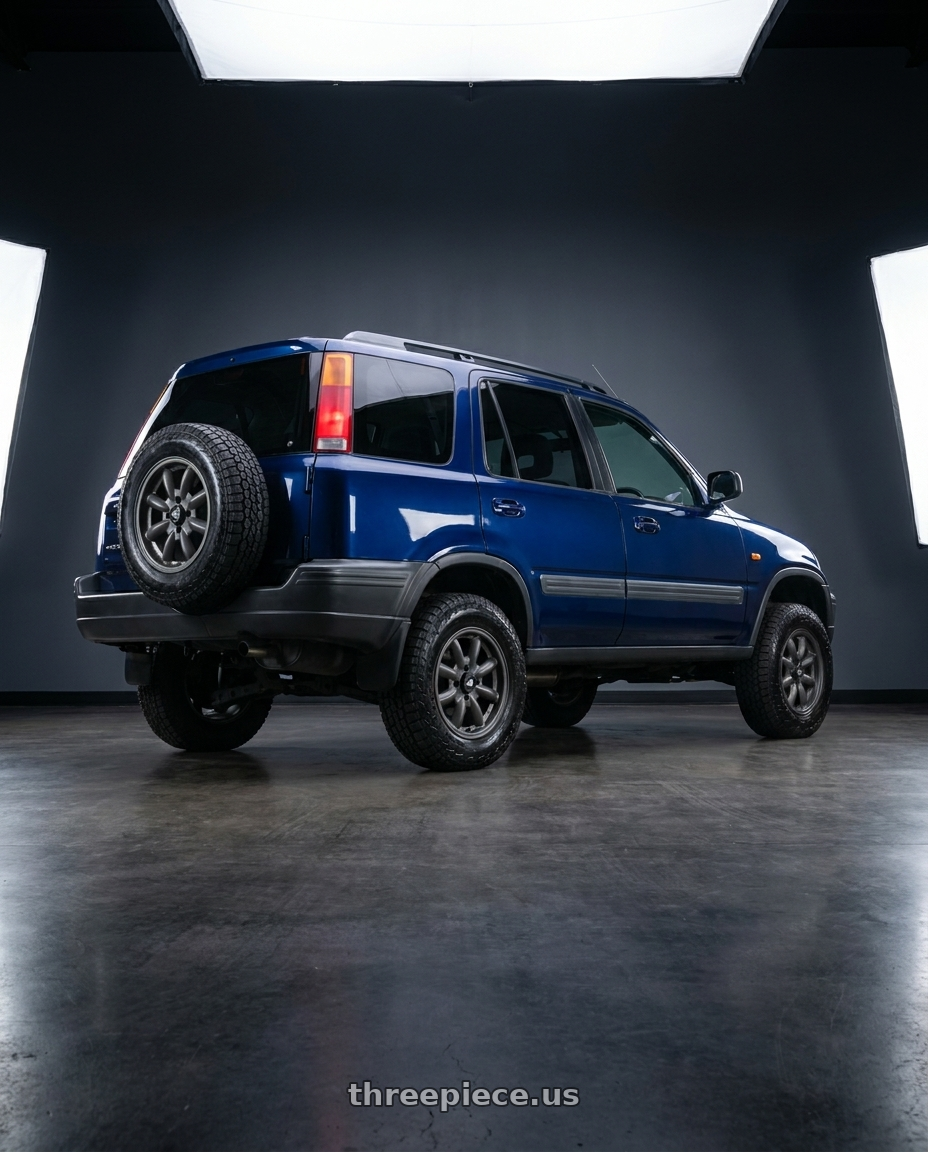 1997 Honda CRV with Enkei Compe 4x114.3 15x7+0 Matte Gunmetal wheels rear three quarter view square tires