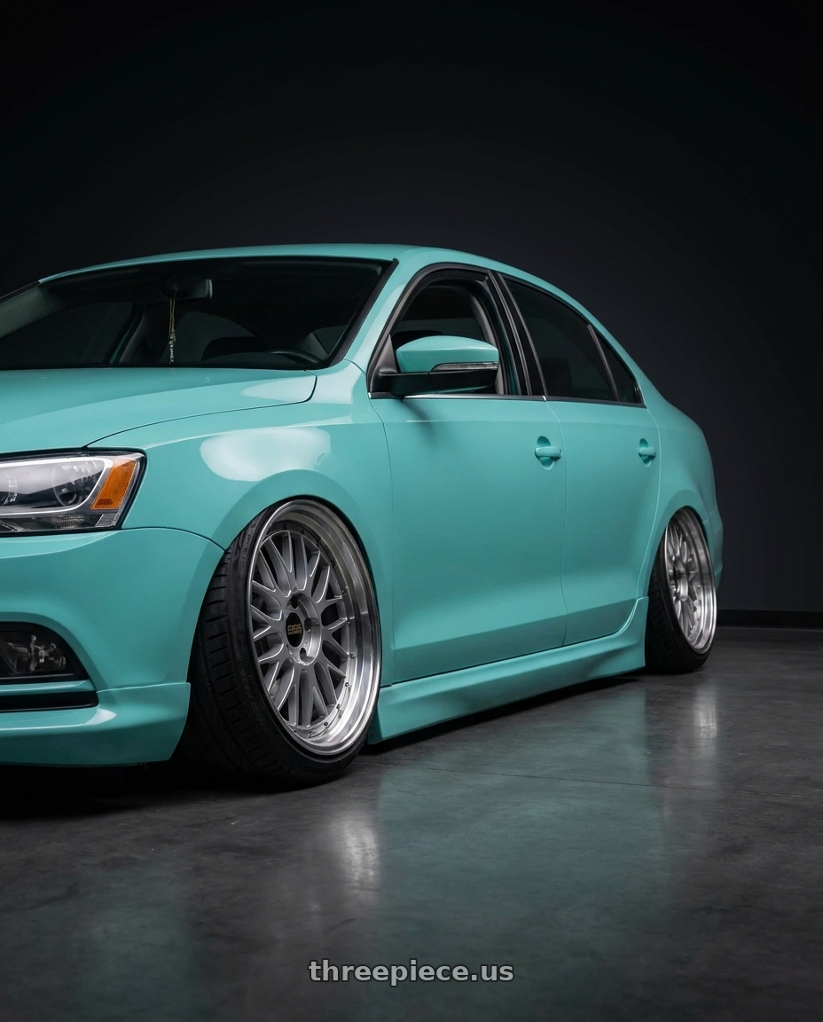 2016 Volkswagen Jetta with BBS LM 5x114.3 18x9.5+38 Diamond Silver wheels rear three quarter view extreme stretch tires