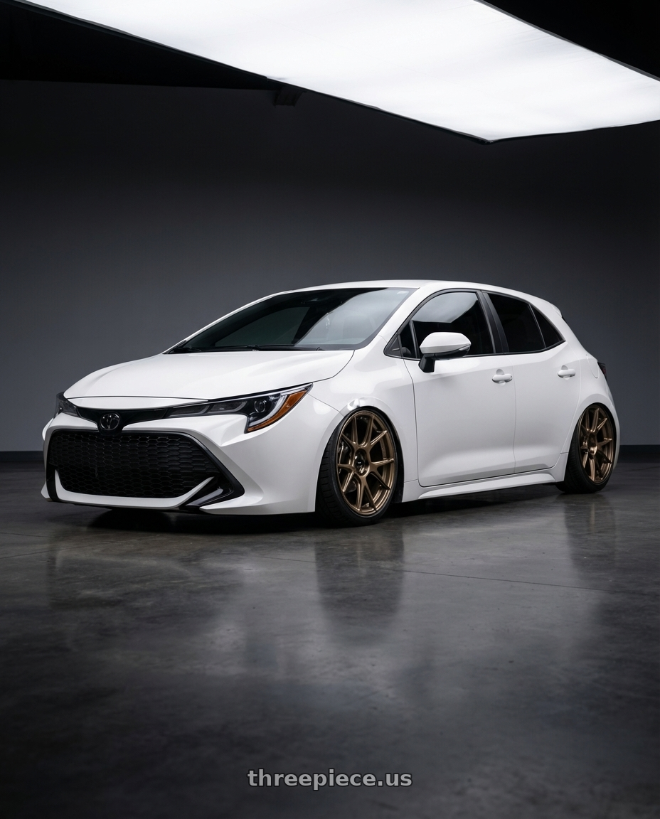 2023 Toyota Corolla Hatchback with Konig Ampliform 5x114.3 18x8.5+45 Gloss Bronze wheels front three quarter view stanced stance