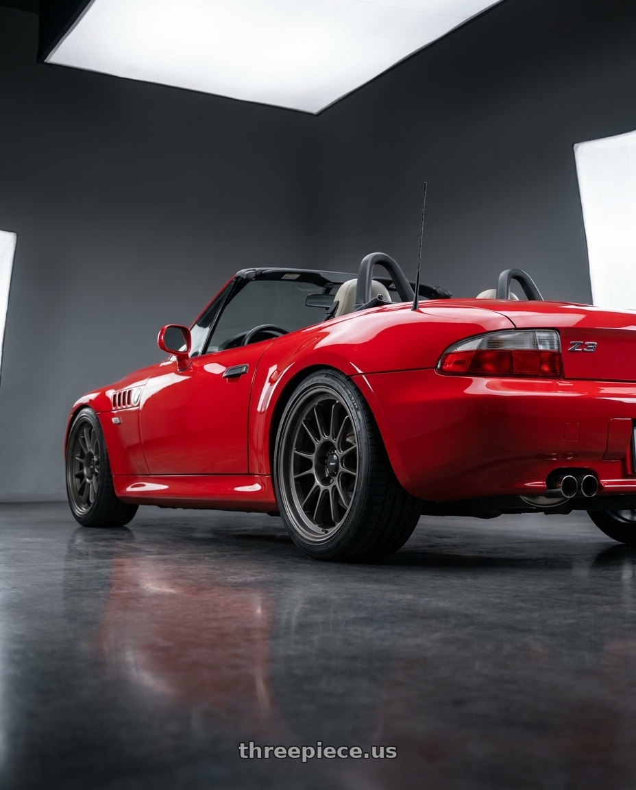 1996 bmw z3 roadster red with Konig Hypergram 5x120 17x8+35 Matte Grey wheels rear three quarter view square tires