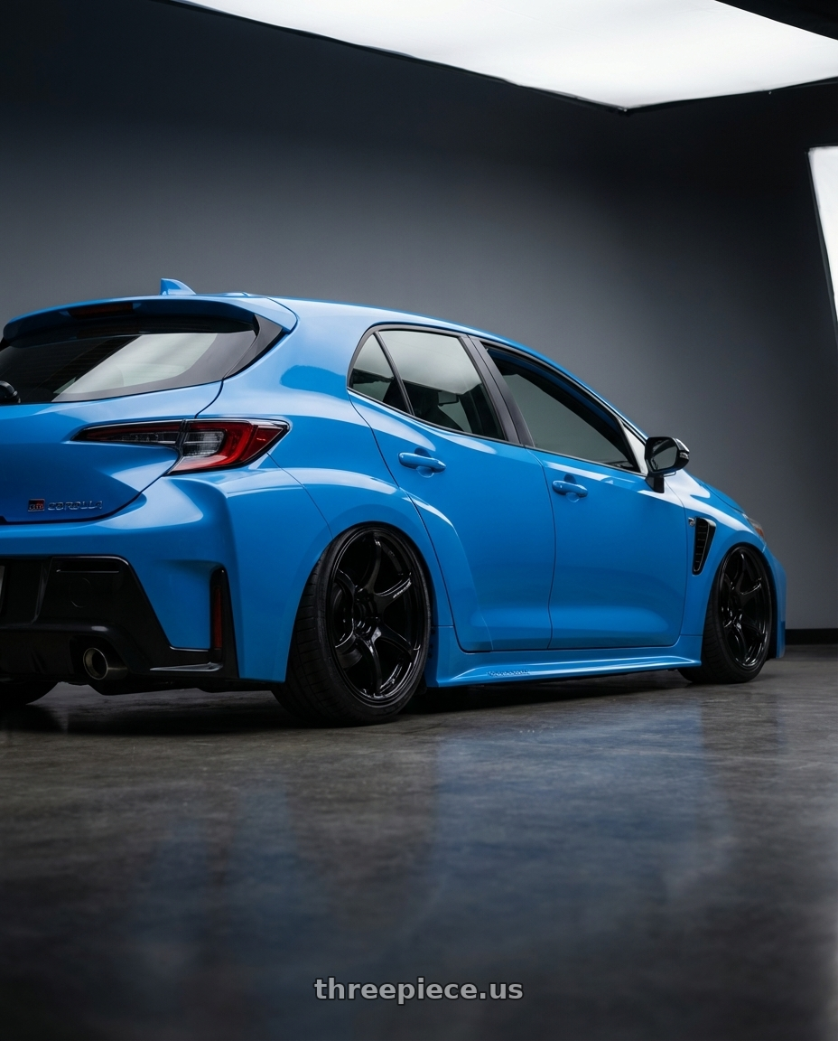 2024 Toyota GR Corolla with Advan RGIII 5x114.3 18x9.0+25 Gloss Black wheels rear three quarter view slight stretch tires
