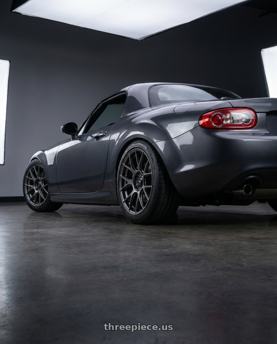 2014 Mazda Miata with Konig Ampliform 5x114.3 17x8+40 Dark Metallic Graphite wheels rear three quarter view square tires