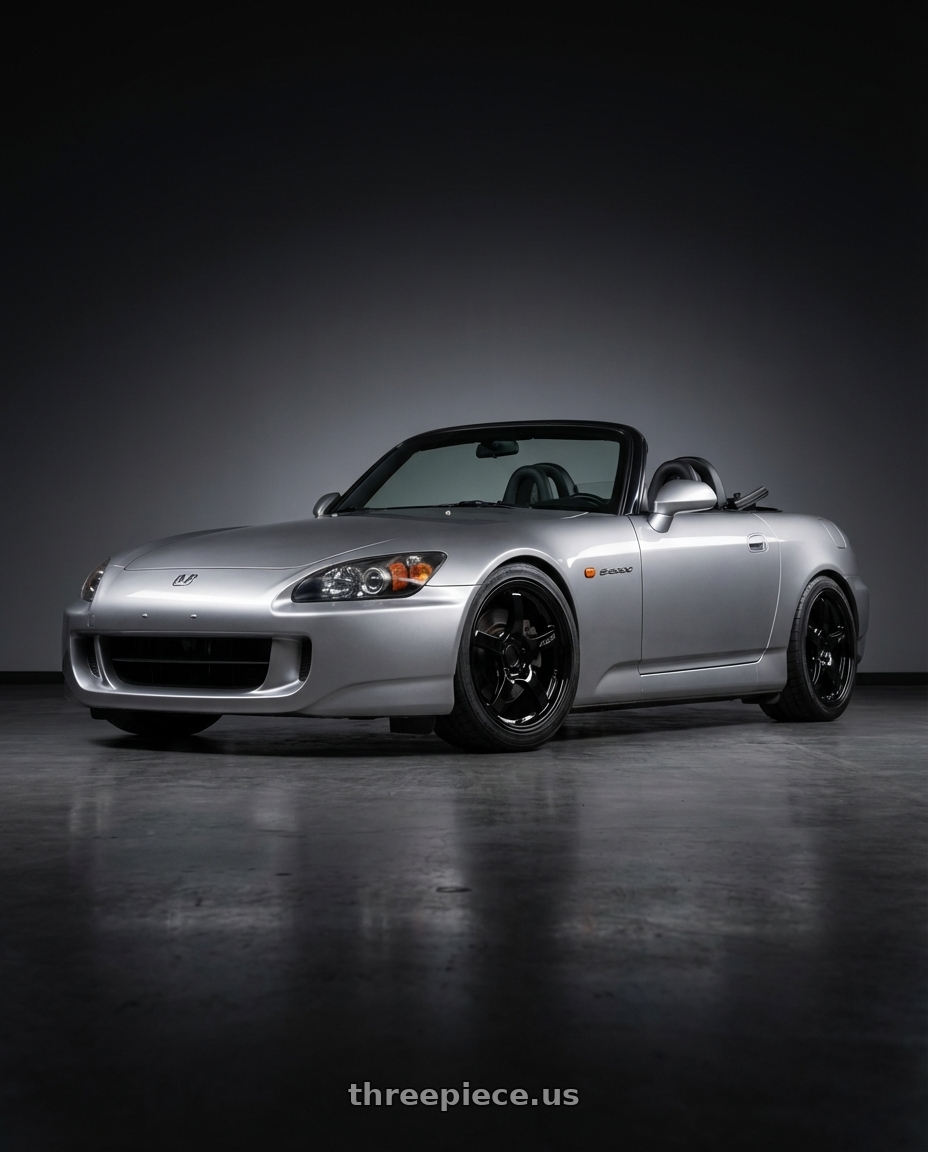 2009 Honda S2000 with Gram Lights 57CR 5x114.3 17x9+22 Glossy Black wheels front three quarter view lowered stance