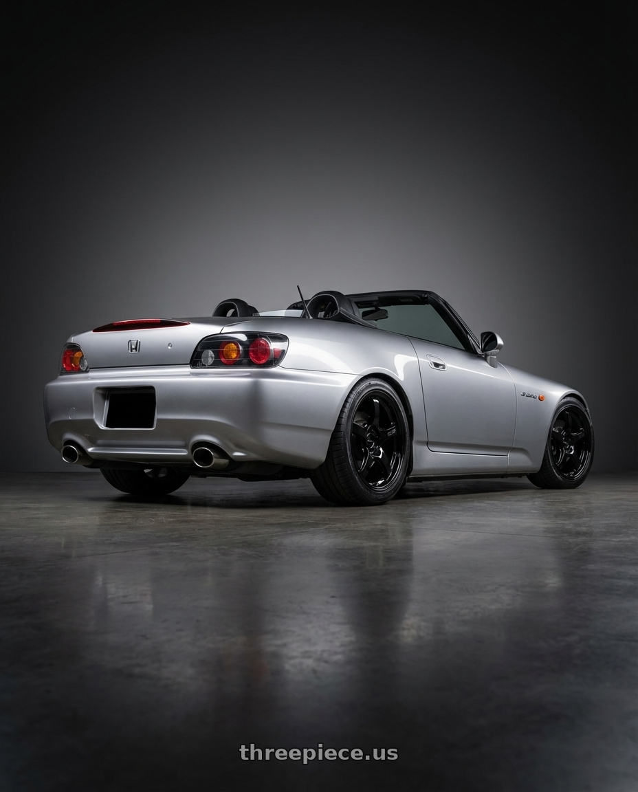 2009 Honda S2000 with Gram Lights 57CR 5x114.3 17x9+22 Glossy Black wheels rear three quarter view square tires