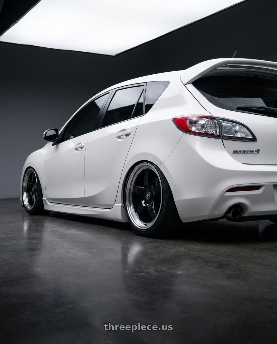 2012 Mazda Mazdaspeed3 with Forgestar D5 Drag 5x114.3 18x10 +42 Gloss Black Machined wheels rear three quarter view slight stretch tires