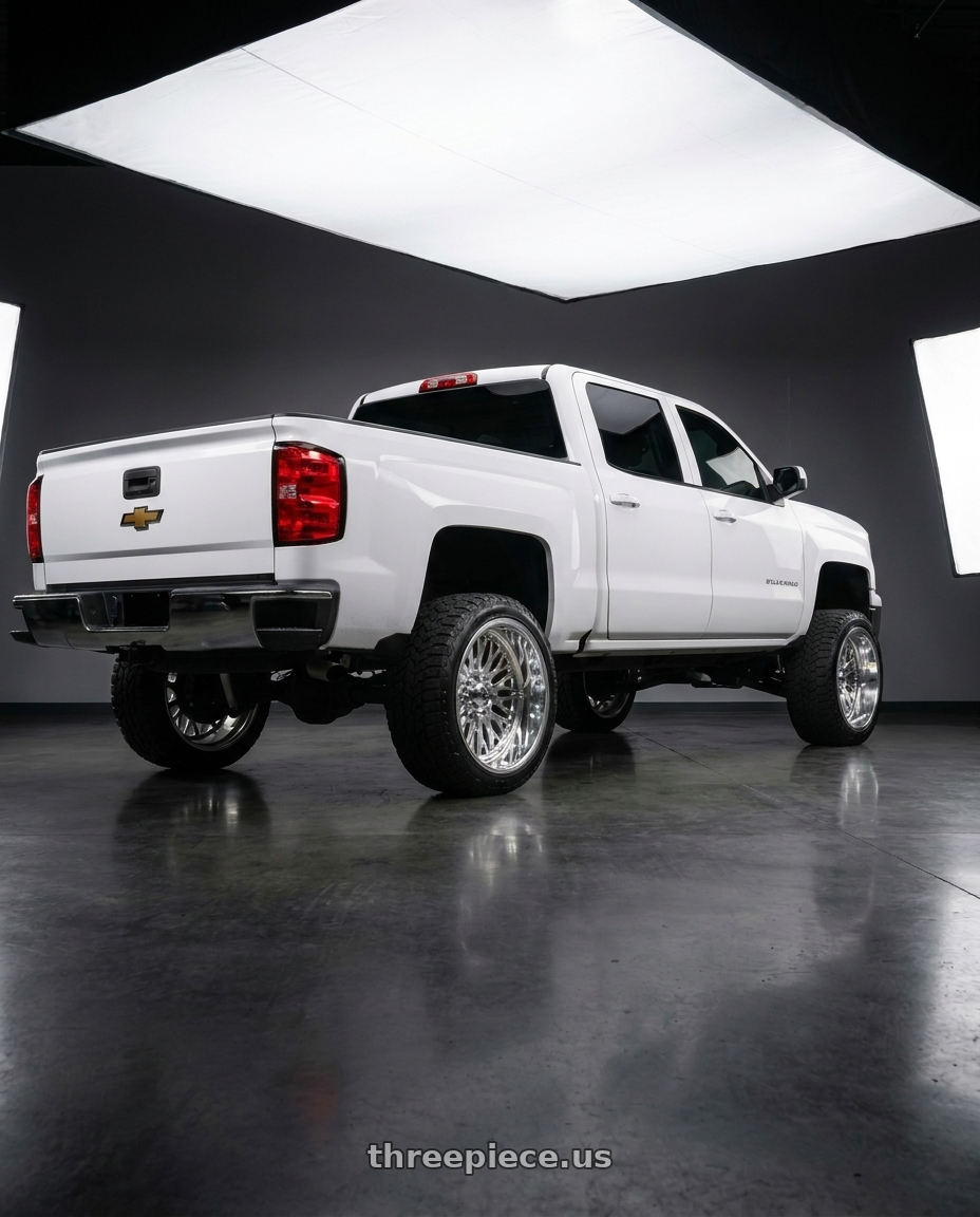 2017 Chevy Silverado with Strada Spina 5x114.3/5x127 22x8.5 +40 Chrome wheels rear three quarter view square tires