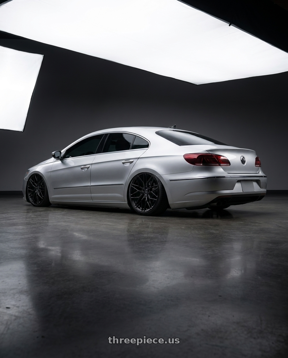 2015 Volkswagen CC with Avant Garde Wheels M520R 5X112 19x8.5 +35 Gloss Black wheels rear three quarter view slight stretch tires