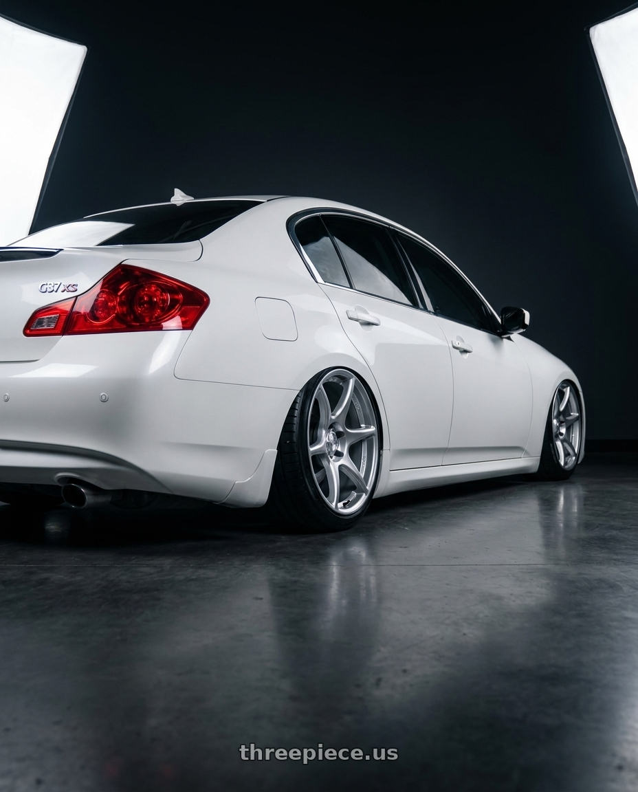 2013 G37xs white with Kansei K11S Tandem 5x114.3 19x9.5 22 Hyper Silver wheels rear three quarter view slight stretch tires