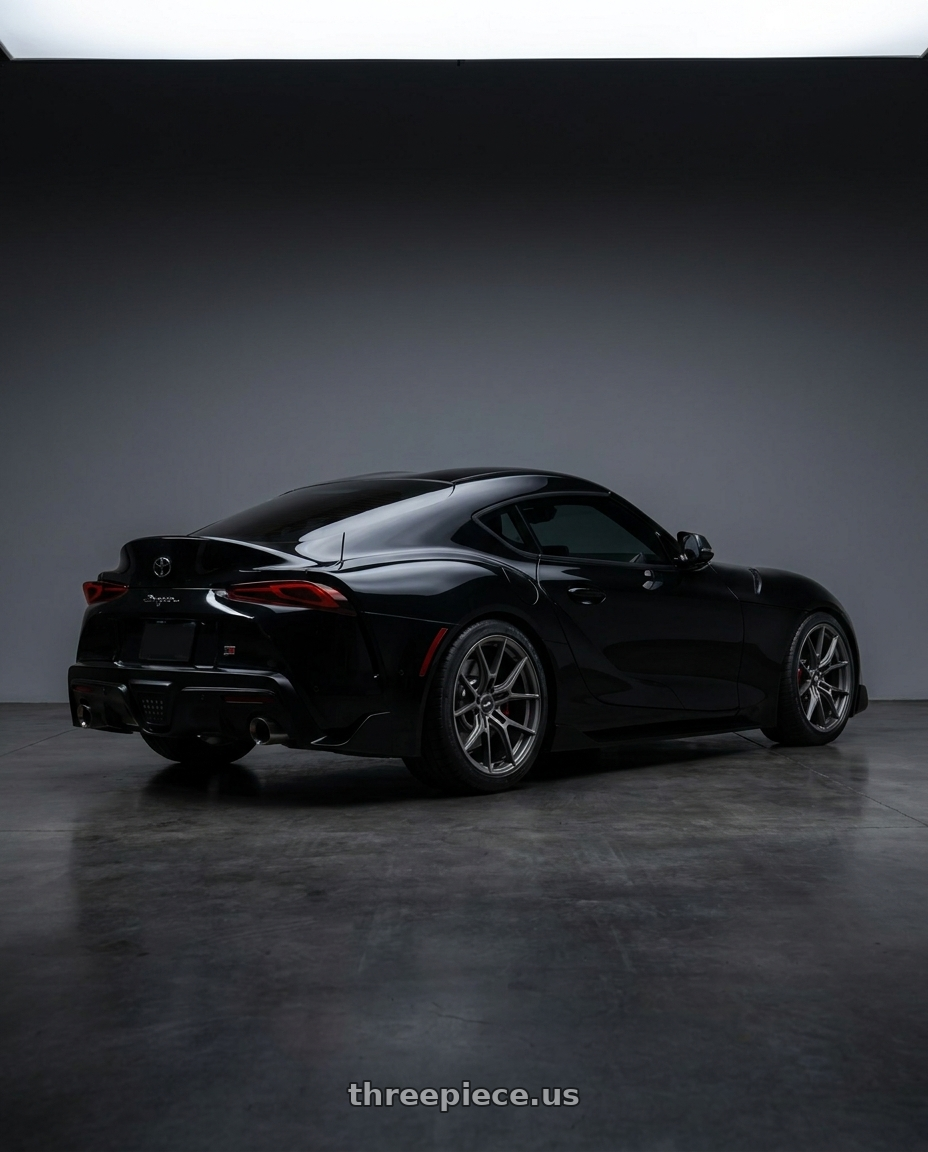 2026 toyota supra with Gram Lights 57FXZ Overseas Model 5x112 19x9.5+25 Matte Graphite wheels rear three quarter view square tires