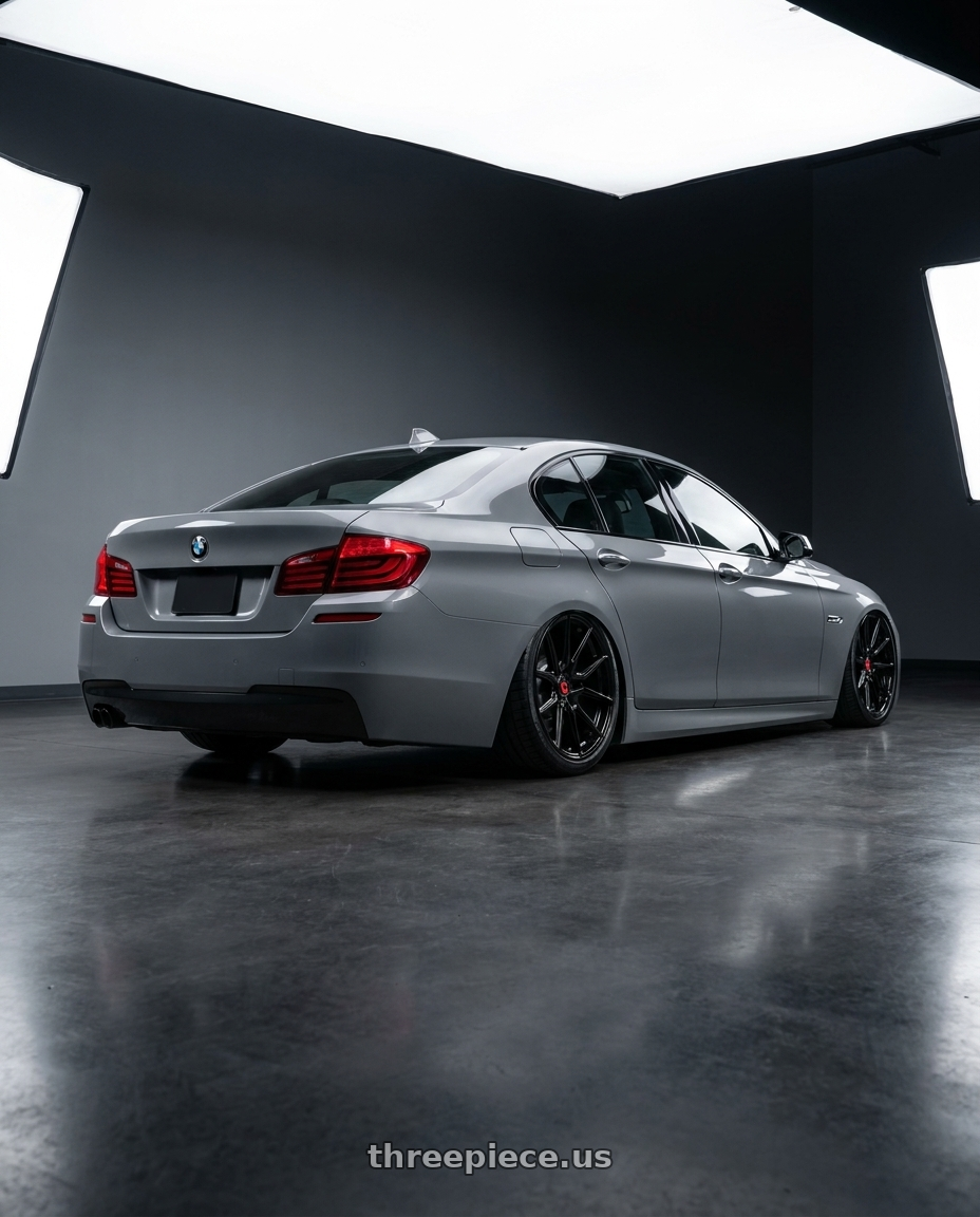 2016 BMW 5 Series F10 with Vossen HF-2 20x9 / 5x120 / ET35 / Flat Face / 66.9 - Gloss Black Wheel - HF2-0B03 wheels rear three quarter view slight stretch tires