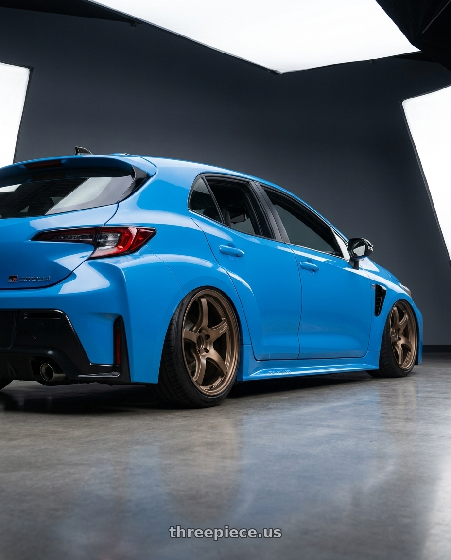 2024 Toyota GR Corolla with Gram Lights 57CR 5x114.3 18x9.5+12 Bronze II wheels rear three quarter view slight stretch tires