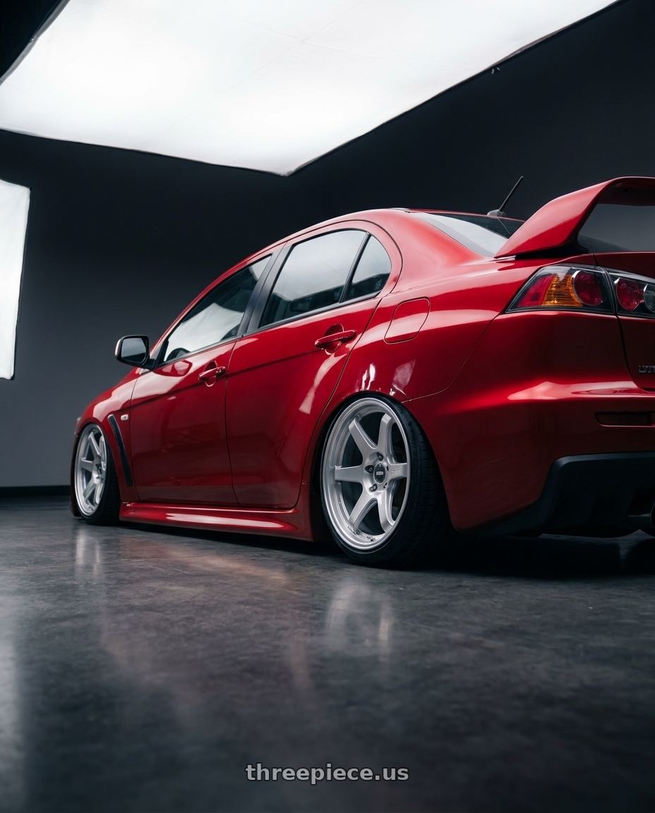 2012 Mitsubishi Lancer Evo X with ESR Wheels APEX SERIES AP6 5x114.3 18x9.5 +22 Hyper Silver wheels rear three quarter view slight stretch tires