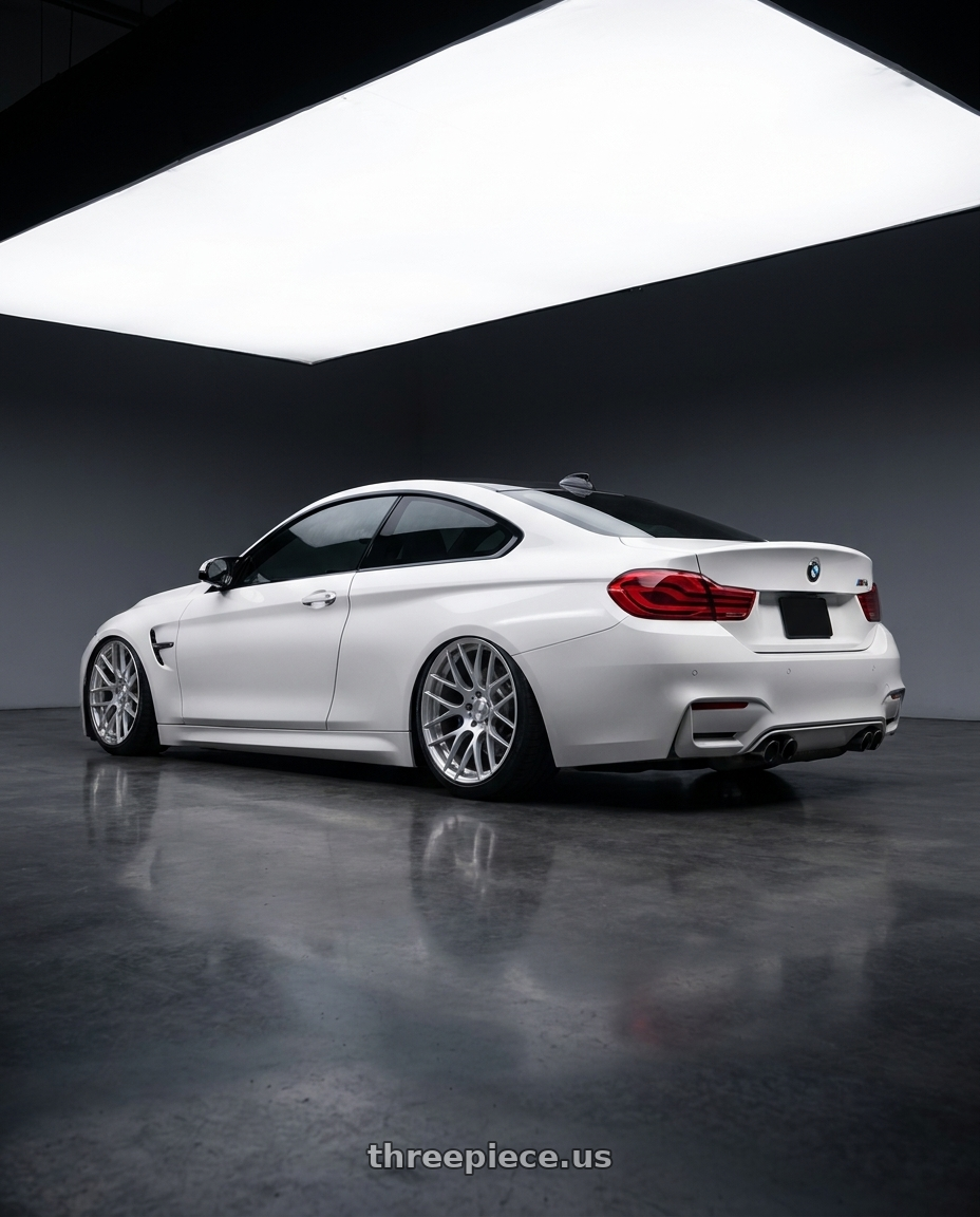 2018 BMW M4 F82 with Avant Garde Wheels M359 5X120 19x11 +25 Hyper Silver wheels rear three quarter view slight stretch tires