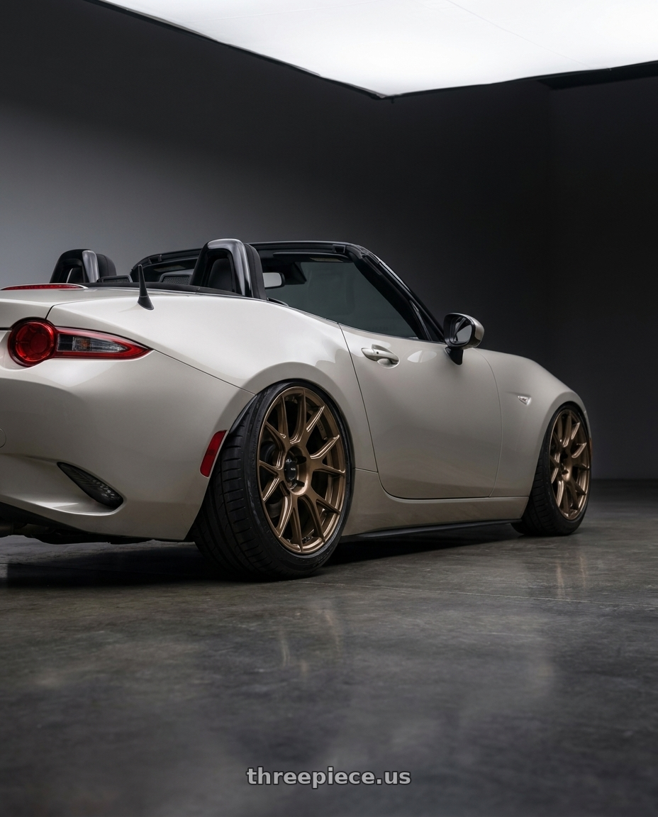 2021 Mazda MX-5 Miata ND with Konig Ampliform 5x114.3 17x8+40 Gloss Bronze wheels rear three quarter view slight stretch tires