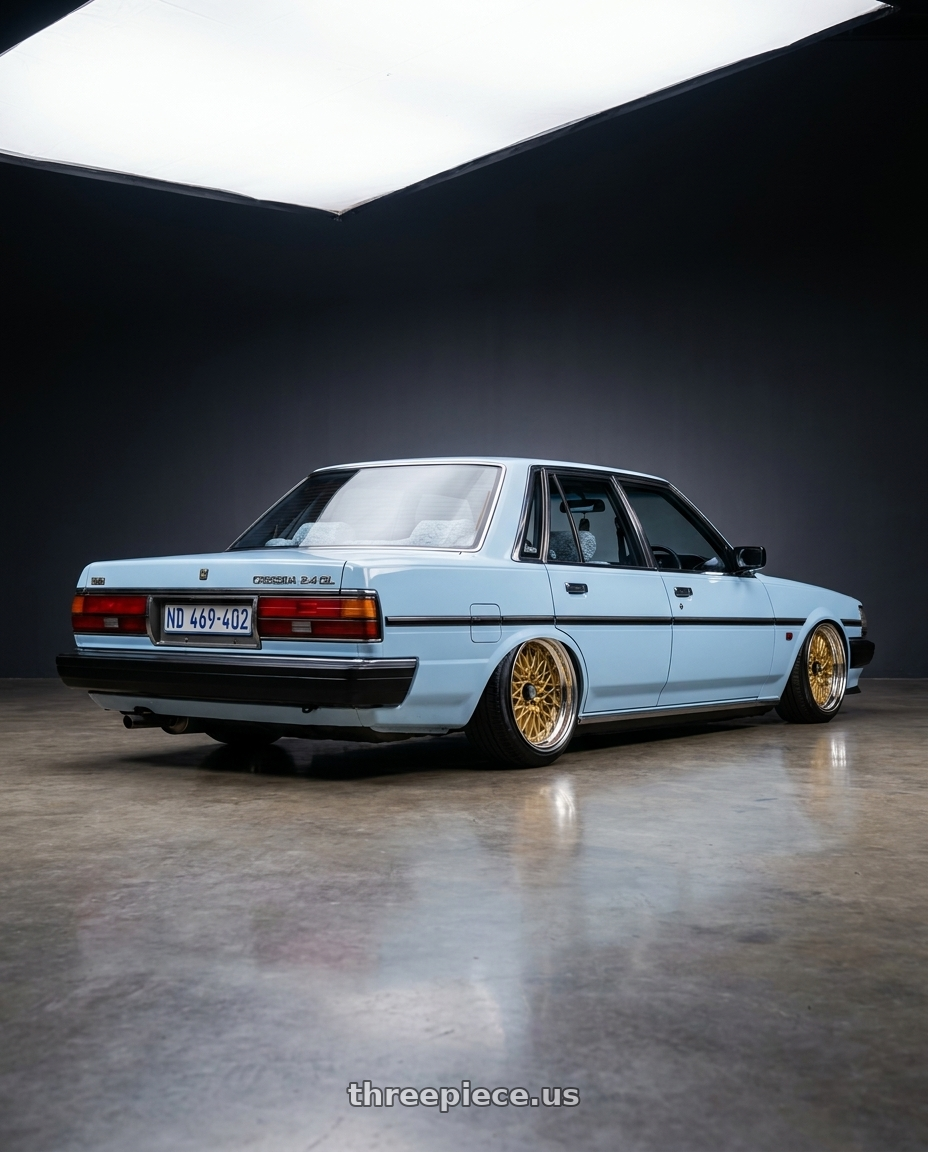 1988 Toyota Cressida MX73 2.4GL in Baby Blue with SSR Formula MESH 5X100 18X10.5+-13 HP Disk Fm Gold wheels rear three quarter view extreme stretch tires