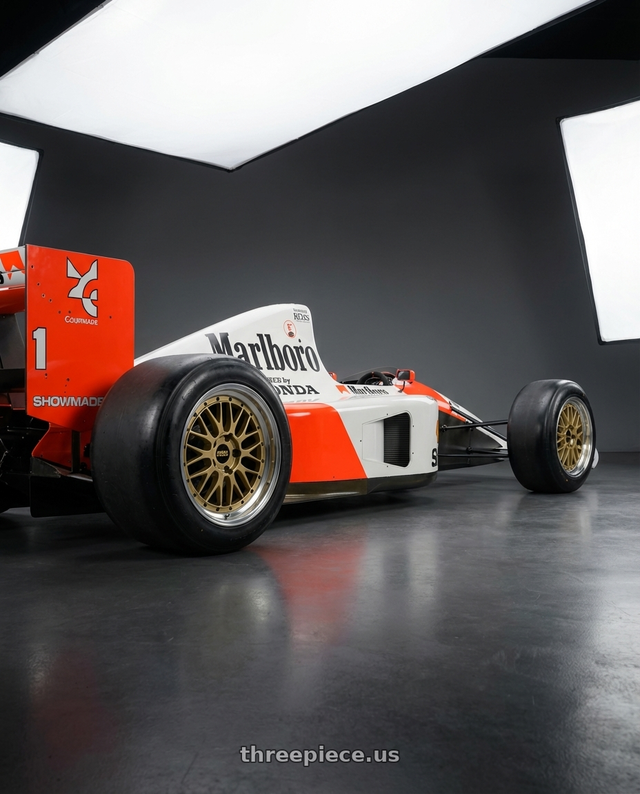 1991 McLaren MP4/6 with BBS LM 5x130 17x7.5 +28 Gold Center Diamond Cut Lip wheels rear three quarter view meaty tires