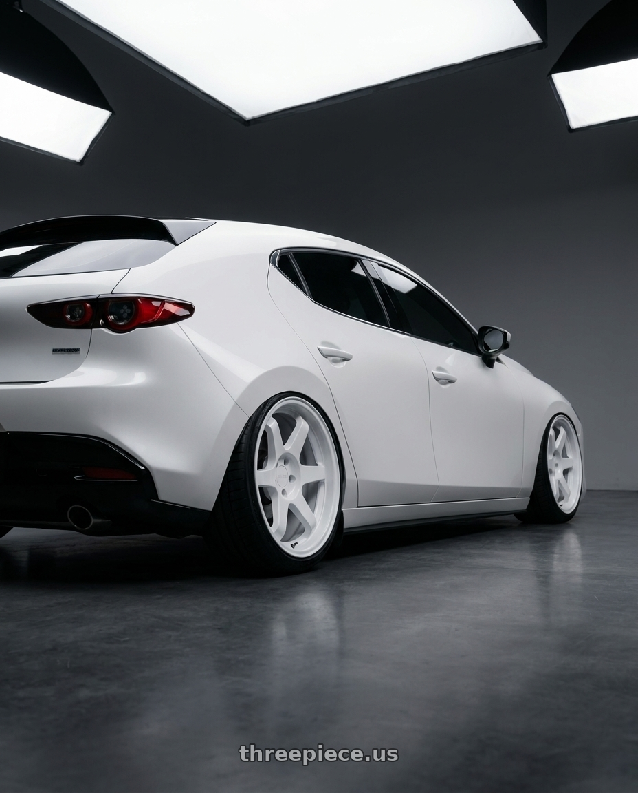 2025 mazda 3 with 9six9 SIX-1 5x108 18X8.5 +35 Competition White wheels rear three quarter view square tires