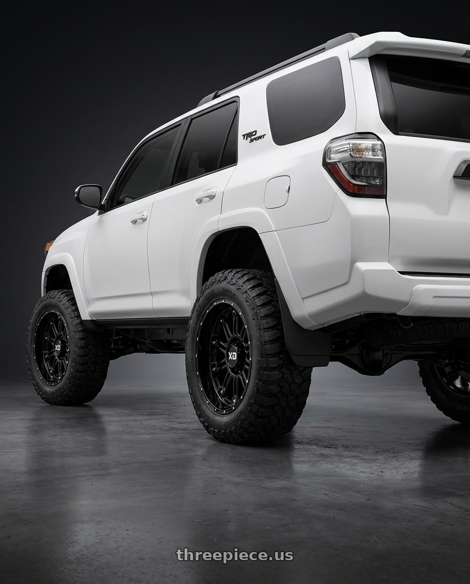 2022 Toyota 4Runner with XD XD829 HOSS II 6X139.7 20X10 -24 GLOSS BLACK wheels rear three quarter view meaty tires