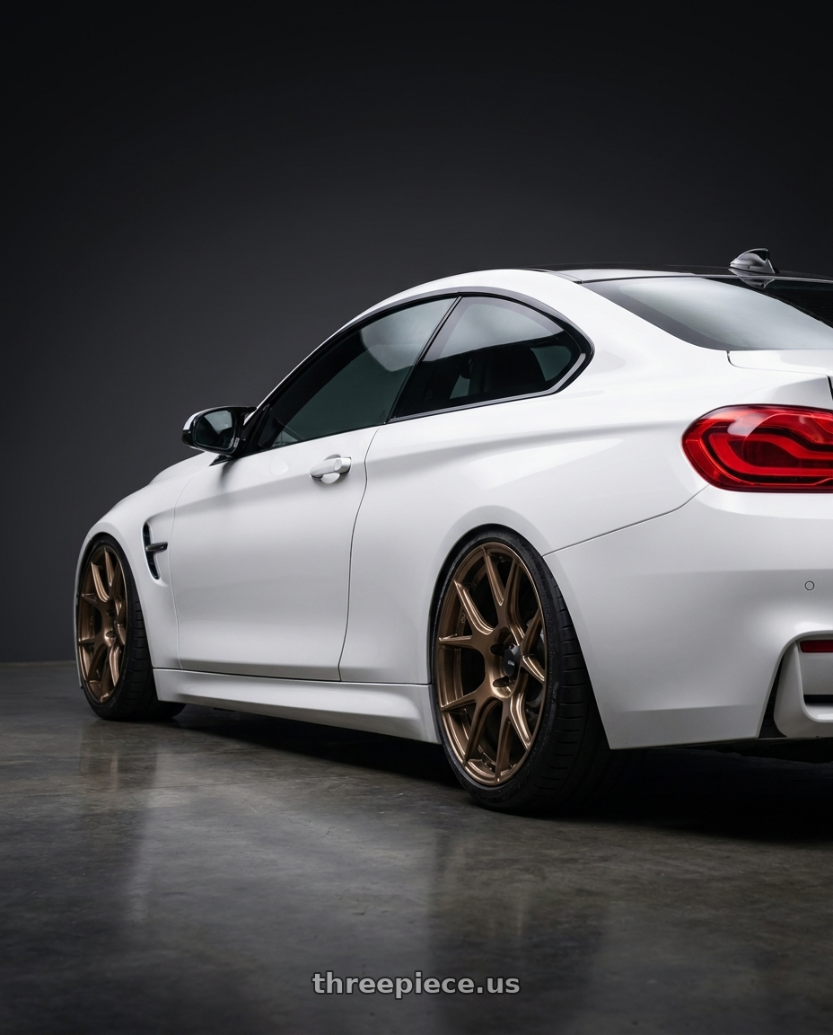 2018 BMW M4 F82 with Konig Ampliform 5x120 19x8.5+32 Gloss Bronze wheels rear three quarter view slight stretch tires