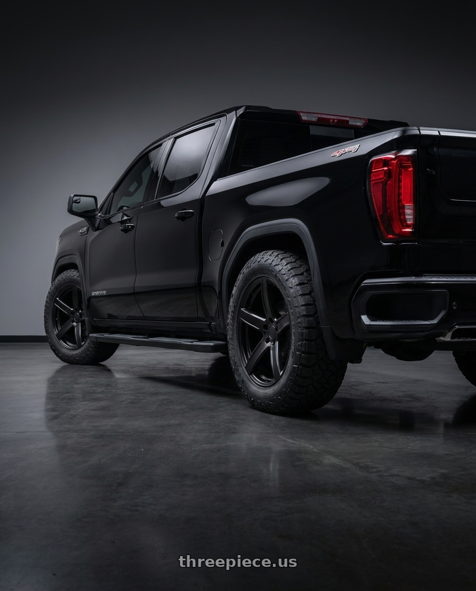 2026 GMC Sierra with OEP 162B 5X115 20x9.5 +15 Gloss Black wheels rear three quarter view meaty tires