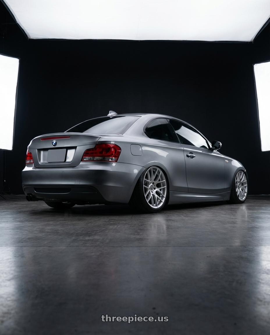 2012 BMW 1 Series E82 with Avant Garde Wheels M359 5X120 19x9 +35 Hyper Silver wheels rear three quarter view slight stretch tires