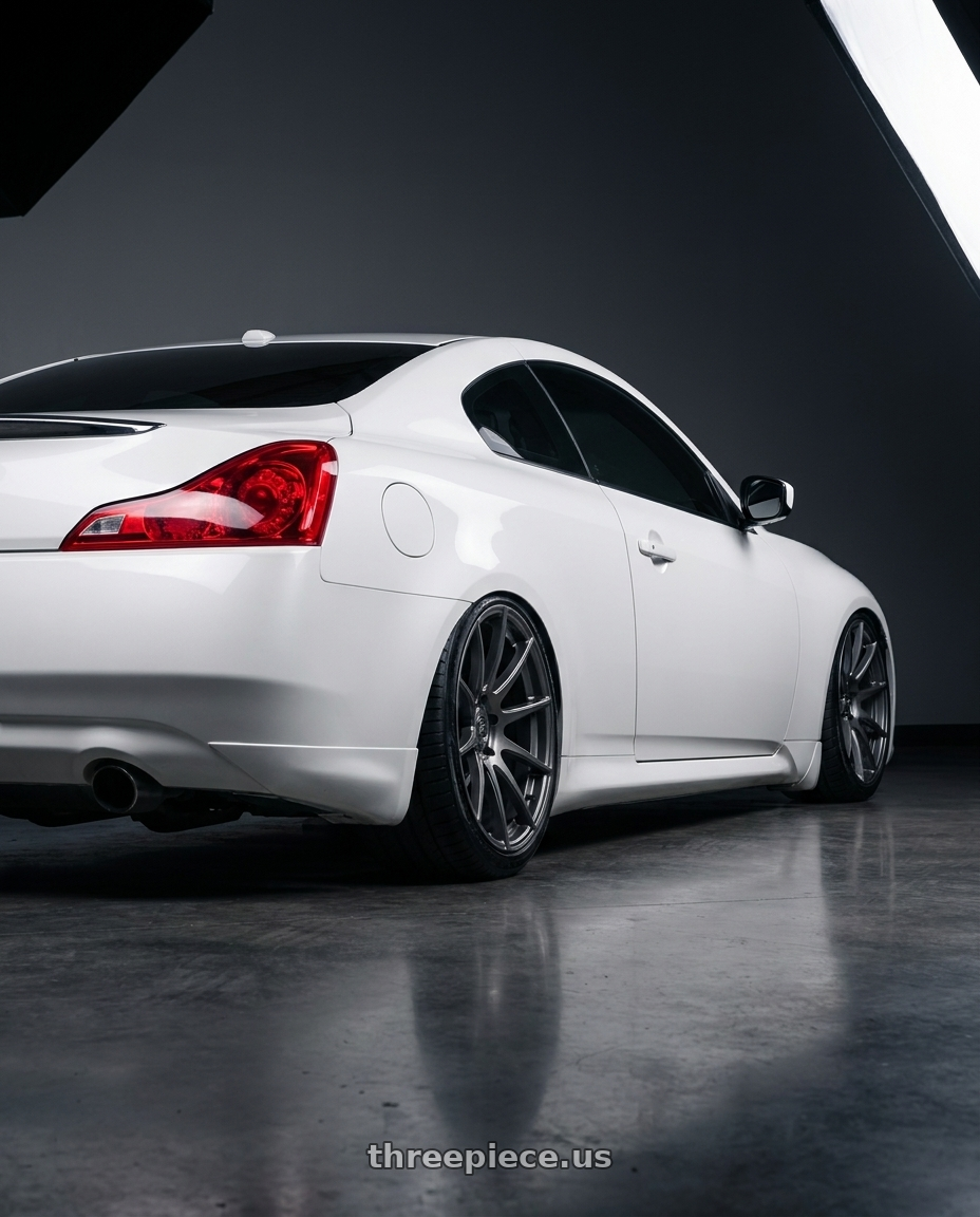 2014 Infiniti G37 Coupe with Forgestar CF10 5x114.3 19x9 +35 Gloss Anthracite wheels rear three quarter view slight stretch tires