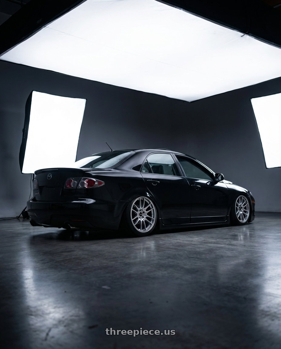 2006 Mazda, Mazdaspeed 6, Grand Touring, Black with Enkei GTC02 5x120 18x8.5+35 Hyper Silver wheels rear three quarter view slight stretch tires