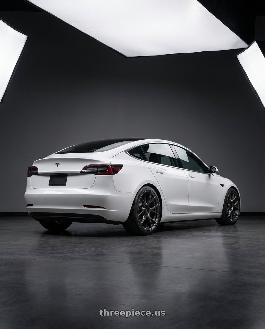 2023 Tesla Model 3 with Konig Ampliform 5x114.3 19x10.5+23 Dark Metallic Graphite wheels rear three quarter view square tires