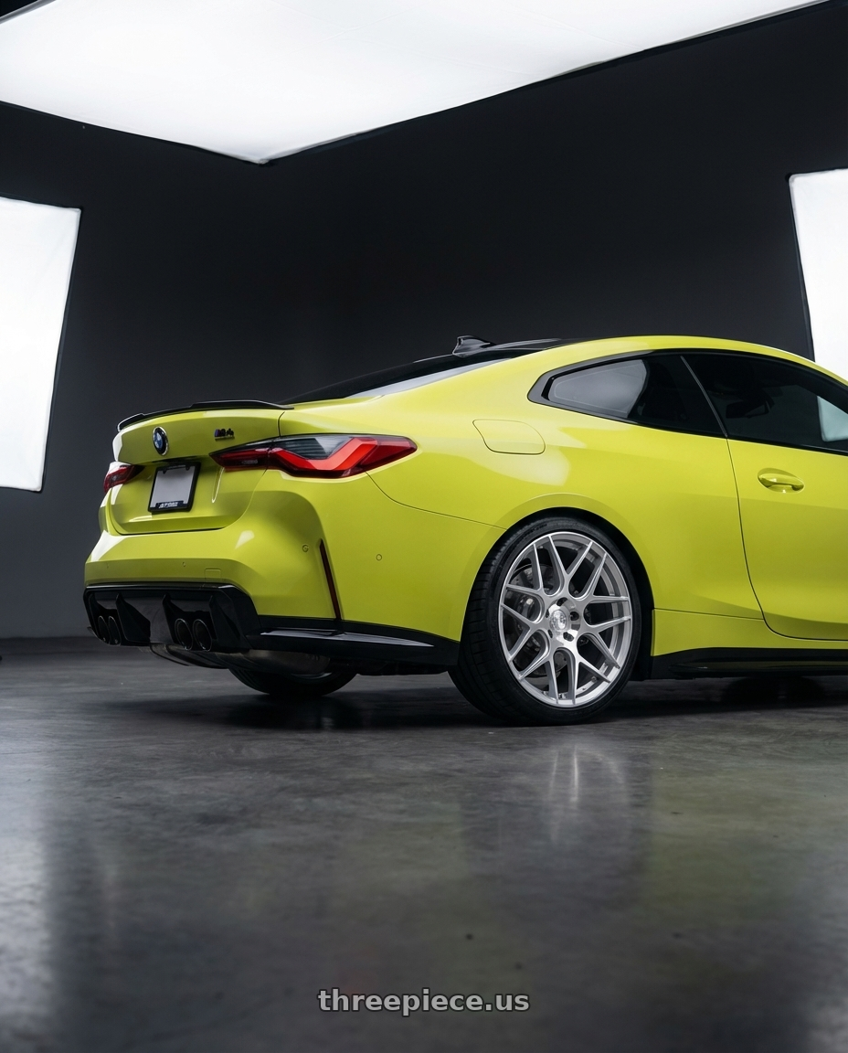 2024 BMW M4 G82 with Aodhan AFF2 5x112 19x8.5+35 Gloss Silver Machined Face wheels rear three quarter view square tires