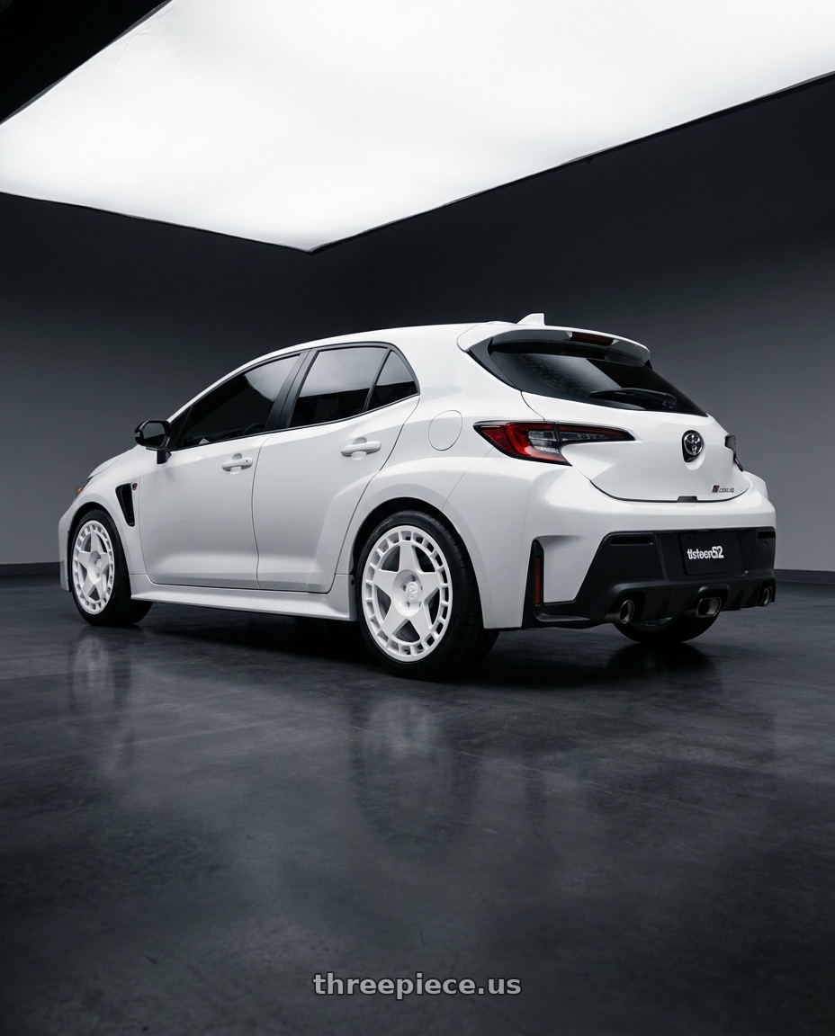 2026 GR Corolla base with fifteen52 TURBOMAC 5x114.3 18x8.5 +30 RALLY WHITE (GLOSS WHITE) wheels rear three quarter view square tires