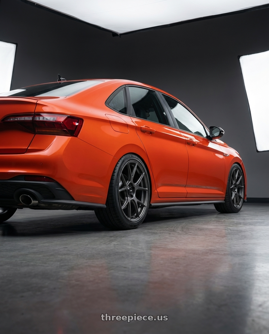 2023 Volkswagen Jetta GLI MK7 with Konig Ampliform 5x112 18x8.5+43 Dark Metallic Graphite wheels rear three quarter view square tires