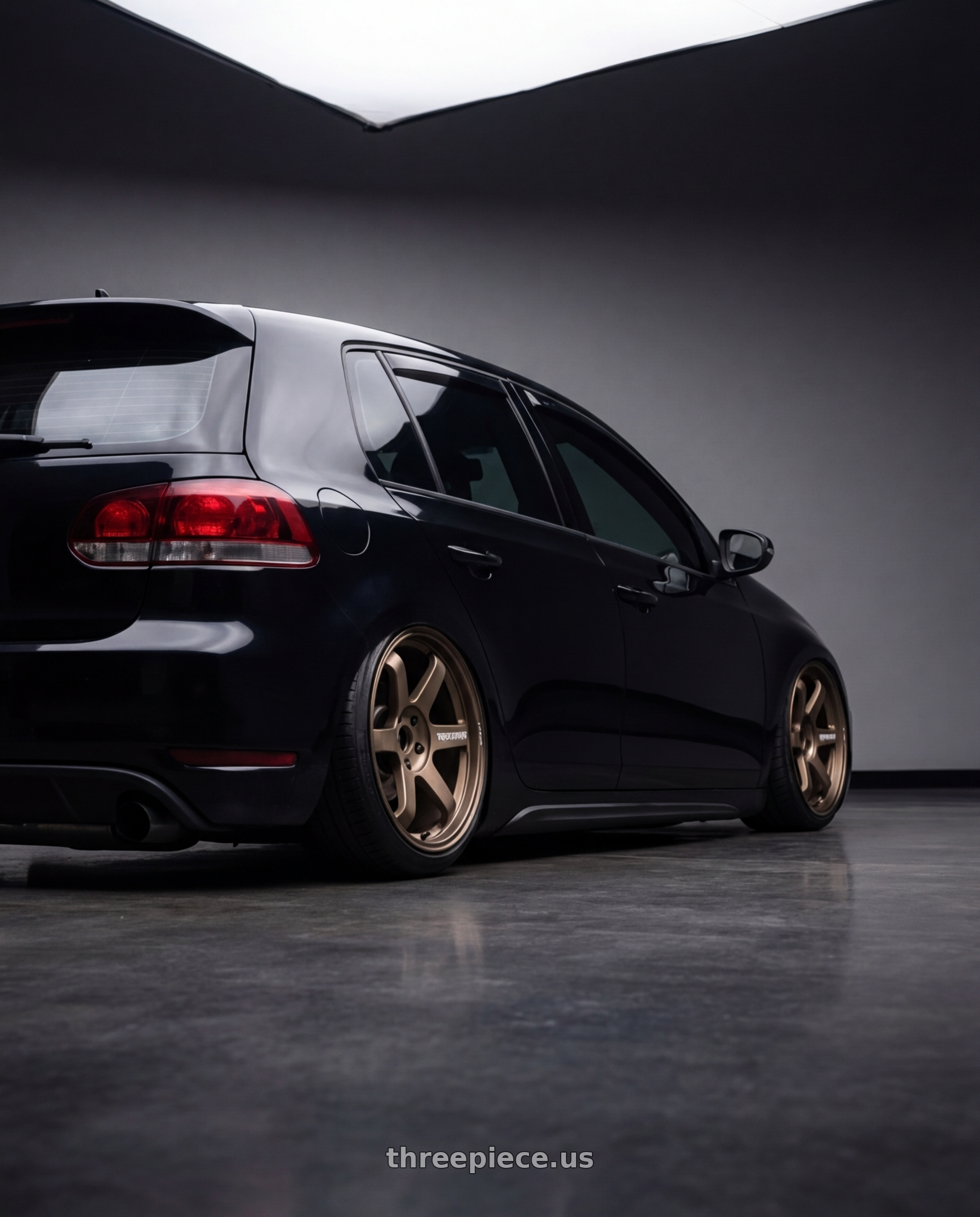 2013 vw gti with Volk Racing TE37 Ultra M Spec 5x112 19x9.5+23 19x10.5+35 Bronze Almite Toyota Supra MK5 Spec wheels rear three quarter view slight stretch tires