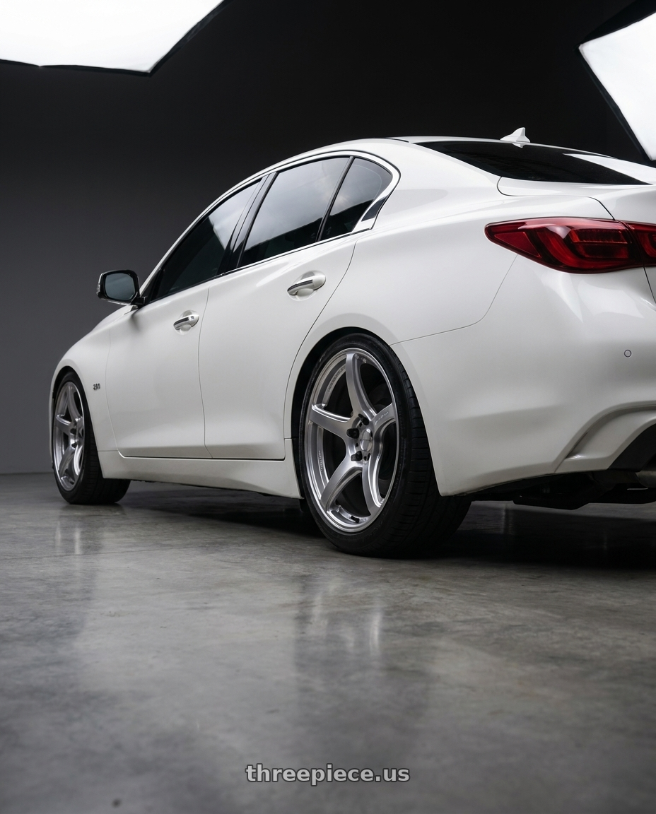 2019 Infiniti Q50 with Work Emotion T5r 5x114.3 19x8.5 +35 Glow Silver wheels rear three quarter view square tires